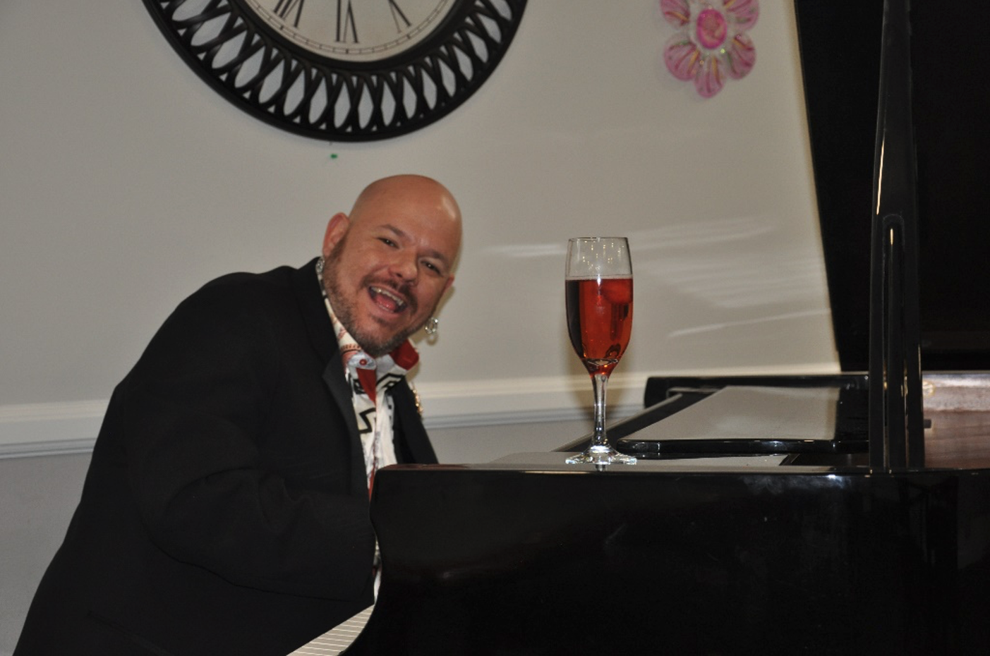 Musician Curtis Labelle performs on a piano